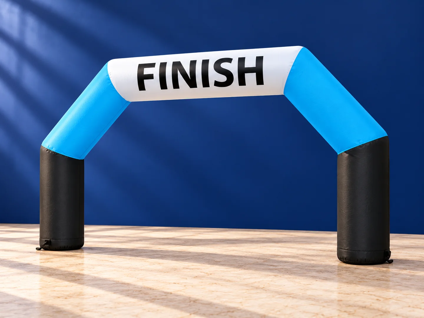 Product design presentation of a blue, white and black inflatable finish arch
