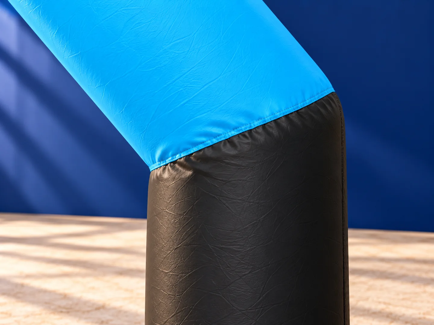 Close-up design presentation of the finish arch blue and black fabric join