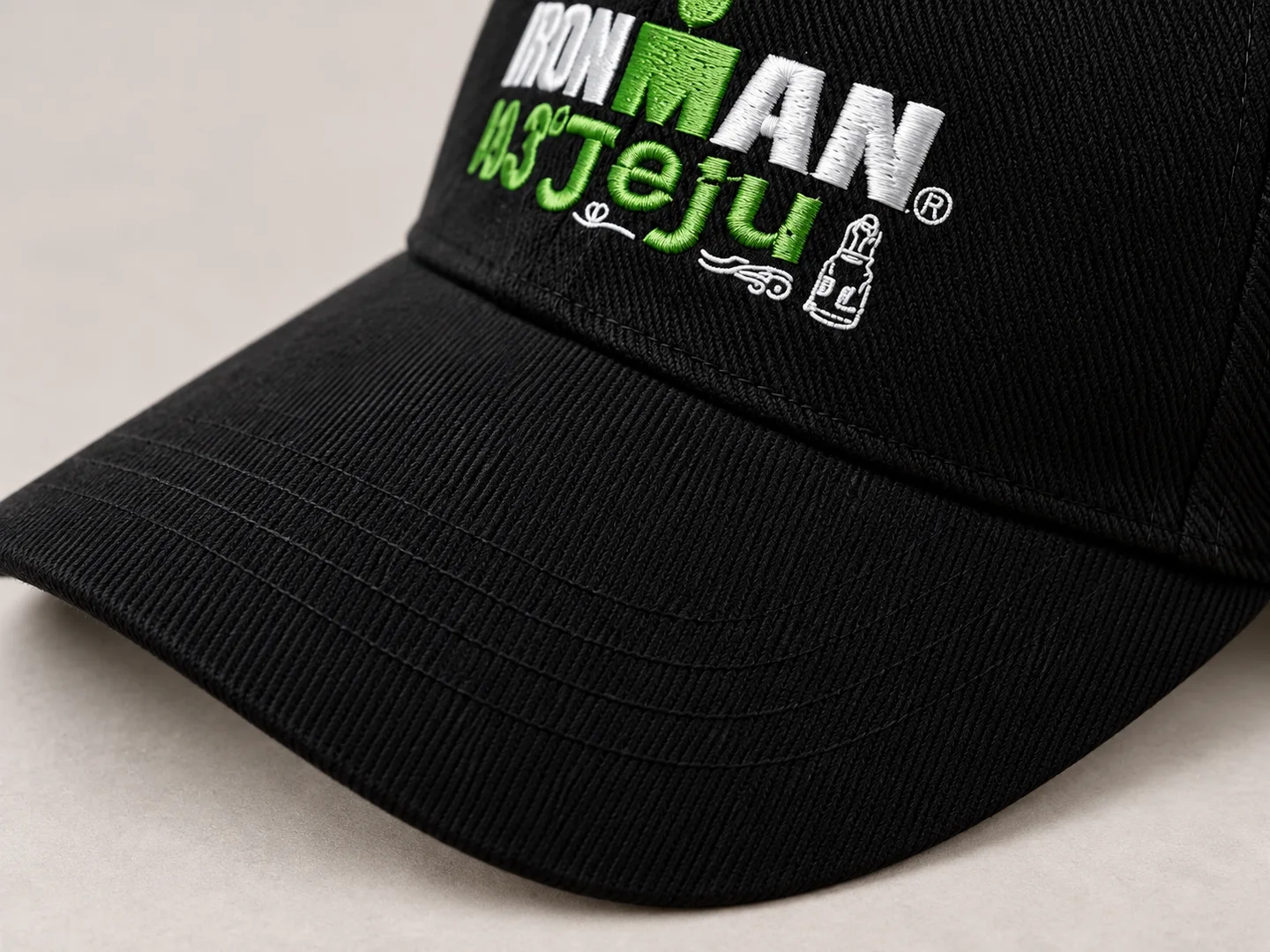 Design presentation close-up of the black cap brim stitching and existing embroidery threads
